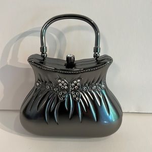 Small metal clutch with butterflies